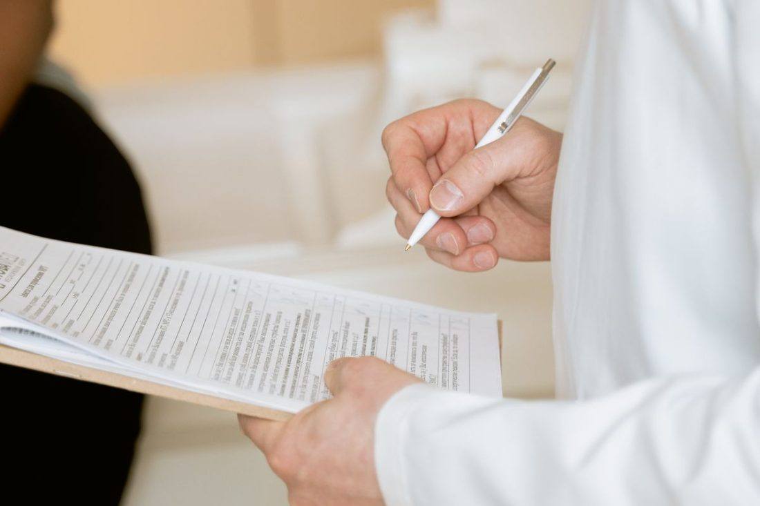 Signing a UK asbestos medical certificate of examination